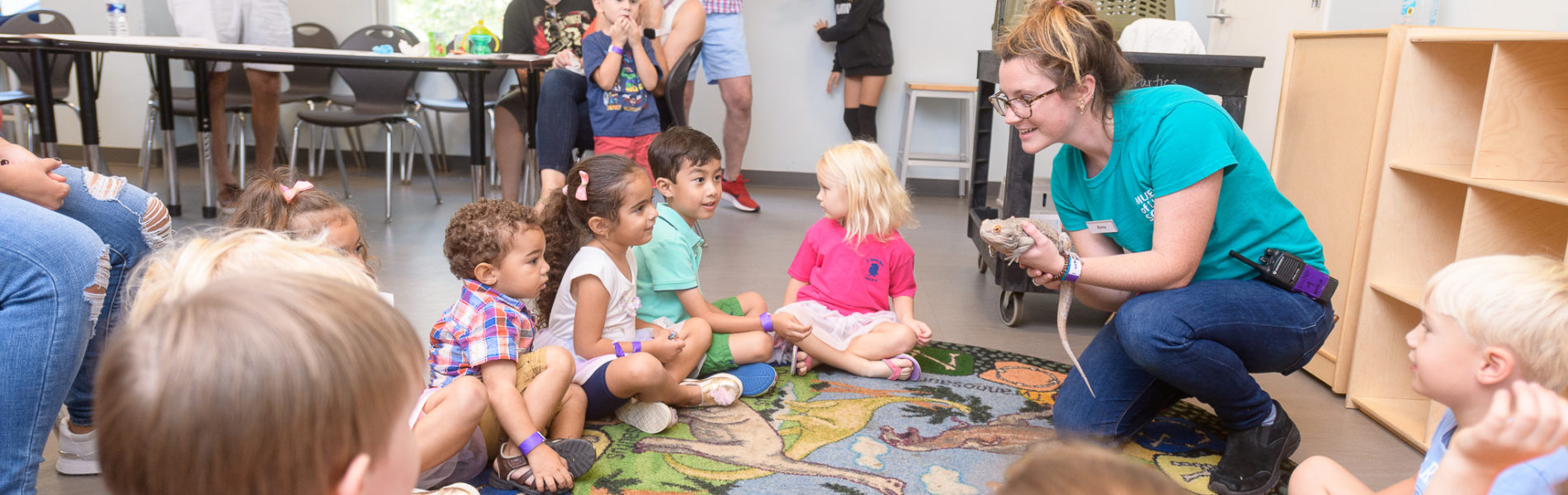 Educator showing animals at a birthday party